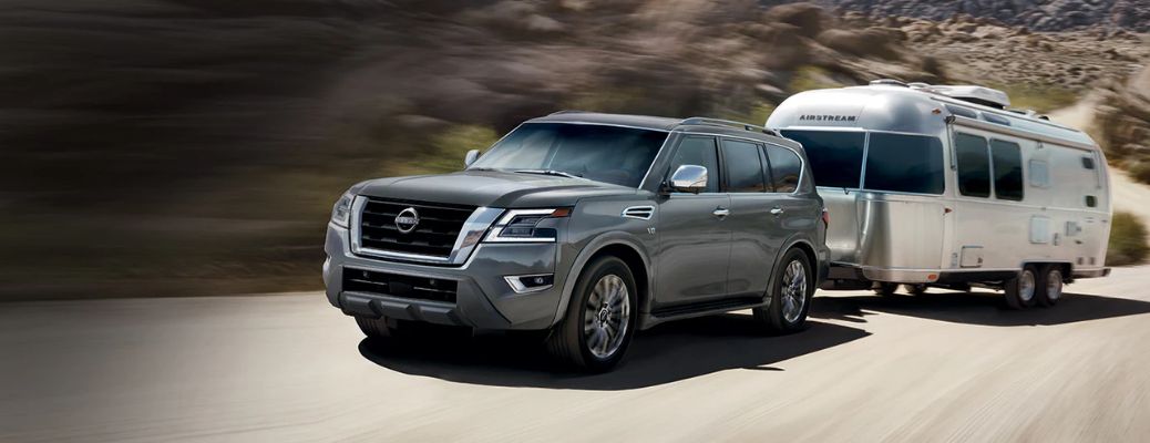 2023 Nissan Armada towing an airstream on mountain road