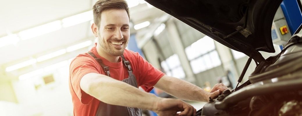 Mechanic checking car's engine