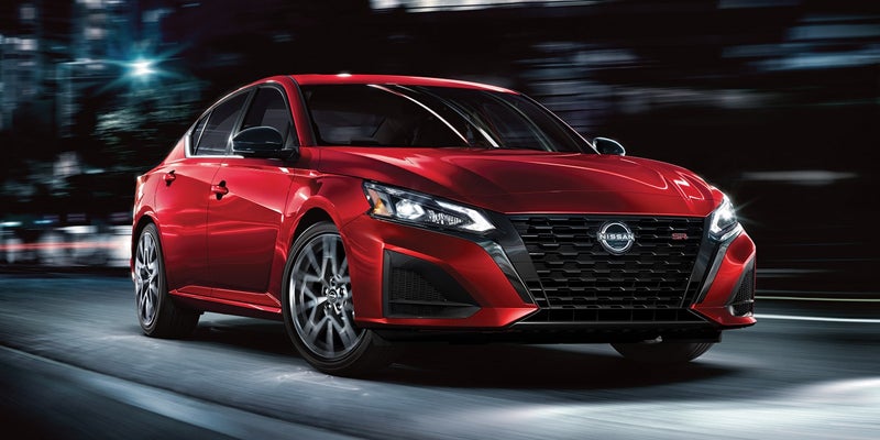 A red 2024 Nissan Altima driving down the road near San Leandro, CA