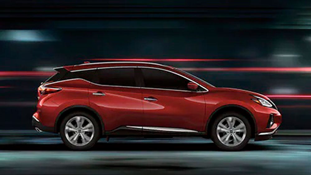 2023 Nissan Murano shown in profile driving down a street at night illustrating performance. | San Leandro Nissan in San Leandro CA